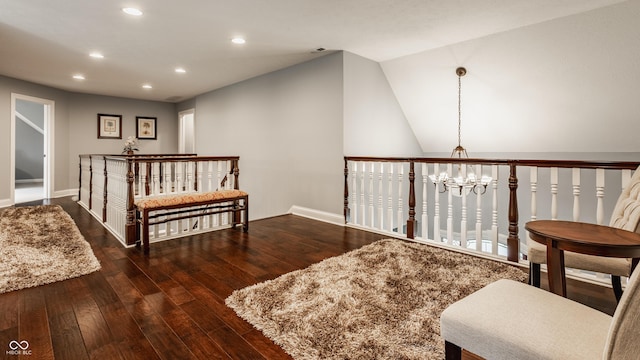 sitting room with recessed lighting, wood-type flooring, baseboards, and a chandelier