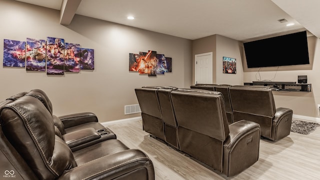 cinema featuring light wood-style flooring, baseboards, and recessed lighting