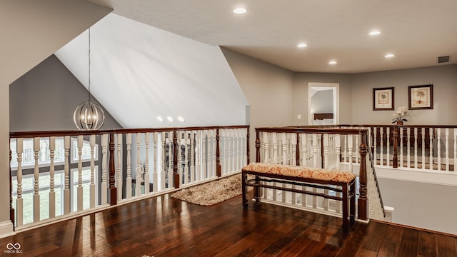 sitting room with recessed lighting, a chandelier, hardwood / wood-style floors, and an upstairs landing