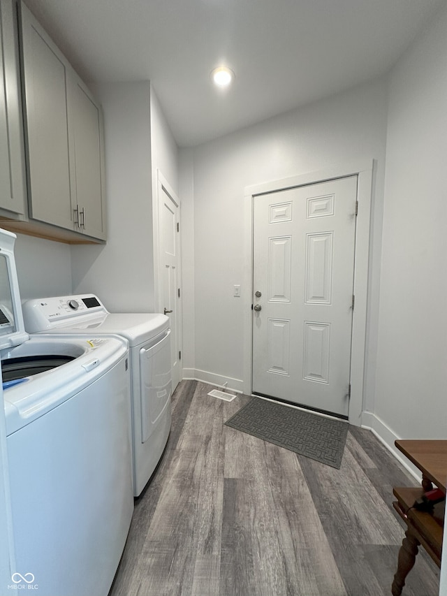 951 N Maiellen Dr, Greenfield, IN 46140 - laundry area featuring washer and dryer, cabinet space, dark wood-style flooring, baseboards, and recessed lighting