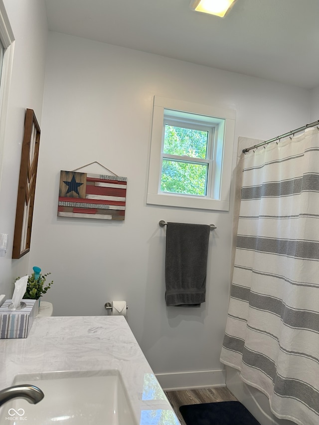 951 N Maiellen Dr, Greenfield, IN 46140 - bathroom with vanity, wood finished floors, curtained shower, and baseboards