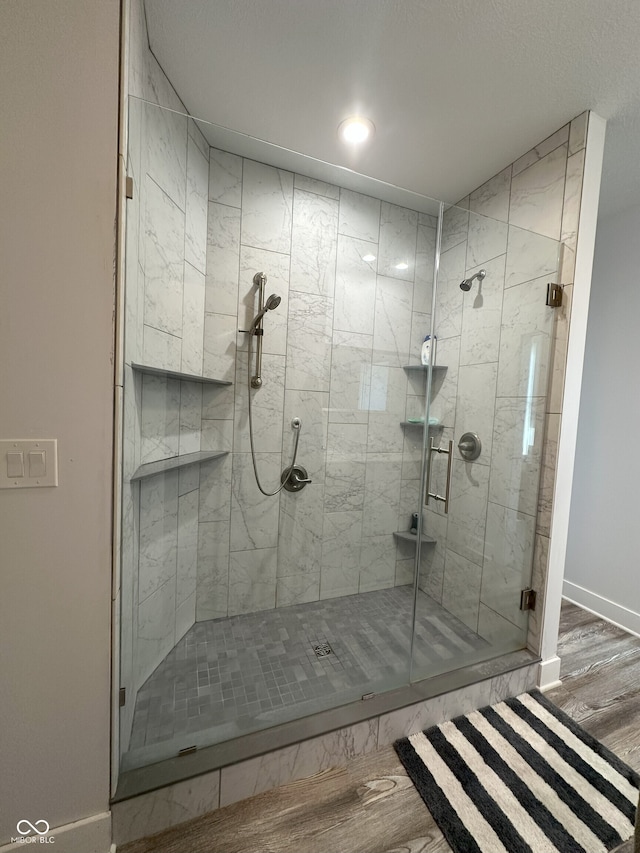 951 N Maiellen Dr, Greenfield, IN 46140 - bathroom with wood finished floors, a shower stall, baseboards, and recessed lighting