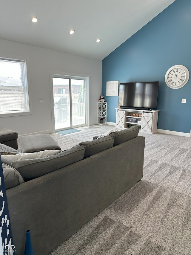 951 N Maiellen Dr, Greenfield, IN 46140 - carpeted living room with baseboards, plenty of natural light, recessed lighting, and lofted ceiling