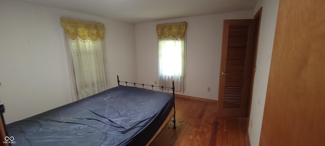 bedroom with wood finished floors