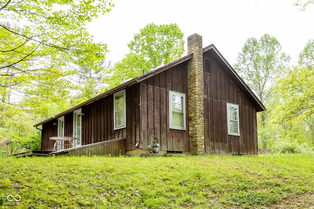 view of side of home with a chimney
