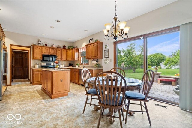 12082 Old Stone Dr, Indianapolis, IN 46236 - dining space featuring a chandelier