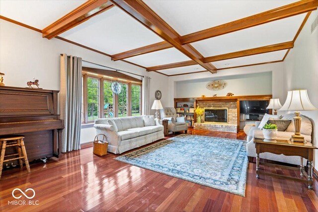 12082 Old Stone Dr, Indianapolis, IN 46236 - living area featuring beamed ceiling, wood finished floors, coffered ceiling, a brick fireplace, and baseboards