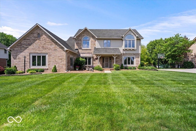 12082 Old Stone Dr, Indianapolis, IN 46236 - view of front of house featuring a front yard, brick siding, and roof with shingles