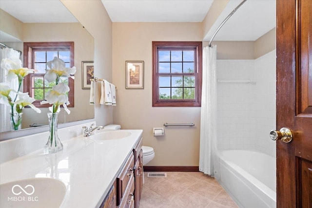 12082 Old Stone Dr, Indianapolis, IN 46236 - bathroom featuring healthy amount of natural light, baseboards, toilet, and tile patterned flooring