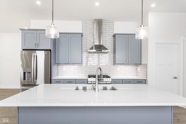 39 N Walcott St, Indianapolis, IN 46201 - kitchen with wall chimney range hood, appliances with stainless steel finishes, gray cabinetry, light wood-style floors, and recessed lighting