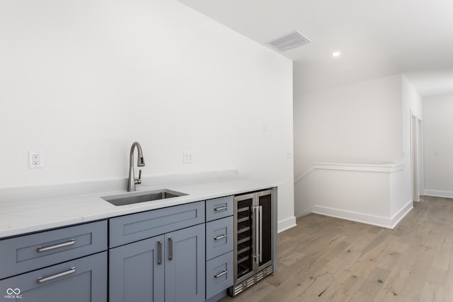 39 N Walcott St, Indianapolis, IN 46201 - indoor bar featuring beverage cooler, light wood finished floors, recessed lighting, and baseboards