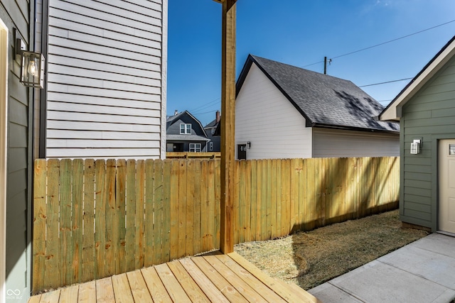39 N Walcott St, Indianapolis, IN 46201 - view of property exterior featuring roof with shingles and fence