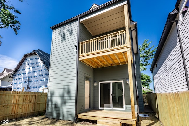 39 N Walcott St, Indianapolis, IN 46201 - rear view of property featuring a balcony and a fenced backyard