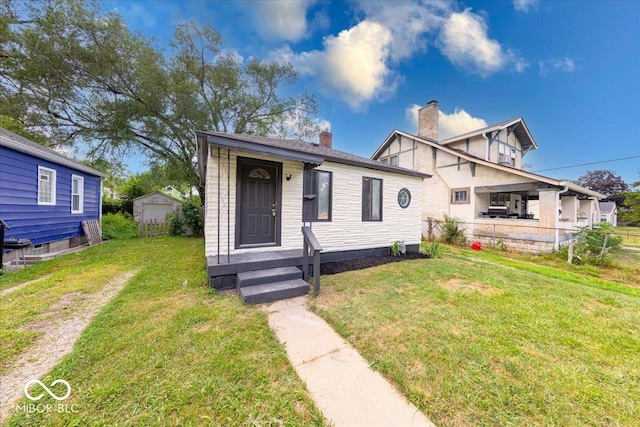 1852 N Warman Ave, Indianapolis, IN 46222 - view of front facade featuring a chimney