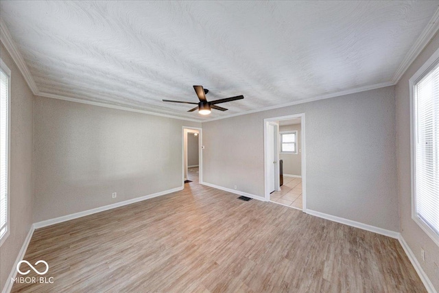 1852 N Warman Ave, Indianapolis, IN 46222 - unfurnished room featuring light wood-type flooring, ornamental molding, and ceiling fan