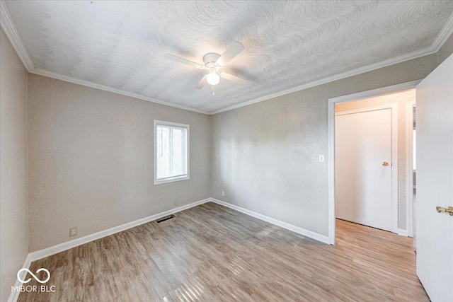 1852 N Warman Ave, Indianapolis, IN 46222 - empty room featuring crown molding, ceiling fan, and wood finished floors