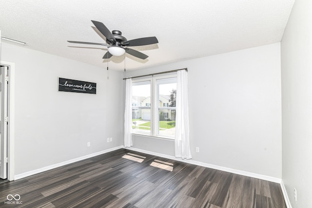 9676 W Constellation Dr, Pendleton, IN 46064 - spare room with dark wood finished floors, baseboards, and a textured ceiling