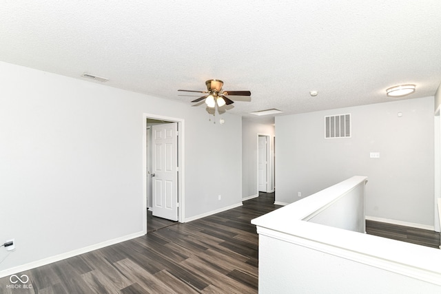 9676 W Constellation Dr, Pendleton, IN 46064 - empty room with dark wood-type flooring, baseboards, ceiling fan, and a textured ceiling