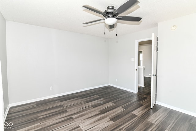9676 W Constellation Dr, Pendleton, IN 46064 - unfurnished room featuring dark wood finished floors, ceiling fan, baseboards, and a textured ceiling