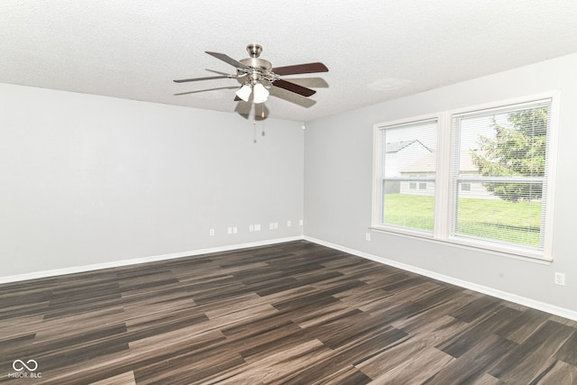 9676 W Constellation Dr, Pendleton, IN 46064 - unfurnished room with dark wood-style flooring, a ceiling fan, a textured ceiling, and baseboards