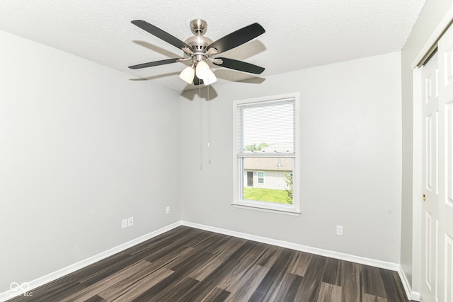 9676 W Constellation Dr, Pendleton, IN 46064 - unfurnished bedroom featuring dark wood-style floors, a closet, baseboards, and a textured ceiling