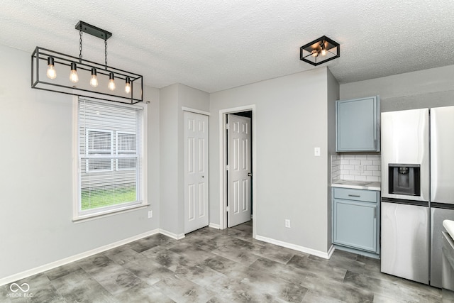 9676 W Constellation Dr, Pendleton, IN 46064 - unfurnished dining area with a textured ceiling and baseboards