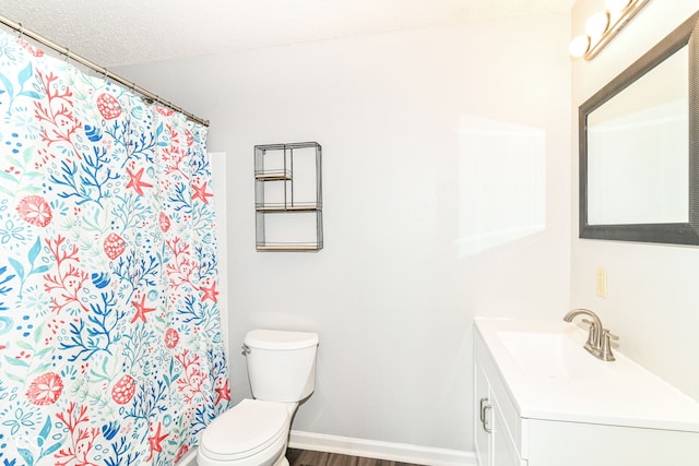 9676 W Constellation Dr, Pendleton, IN 46064 - full bath featuring toilet, vanity, baseboards, wood finished floors, and a shower with shower curtain