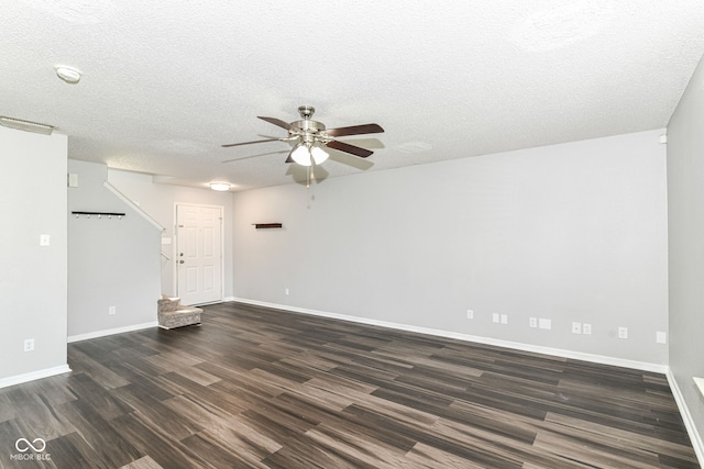 9676 W Constellation Dr, Pendleton, IN 46064 - unfurnished living room featuring dark wood-style floors, ceiling fan, a textured ceiling, and baseboards