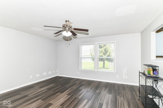 9676 W Constellation Dr, Pendleton, IN 46064 - unfurnished living room with dark wood-style floors, a ceiling fan, a textured ceiling, and baseboards