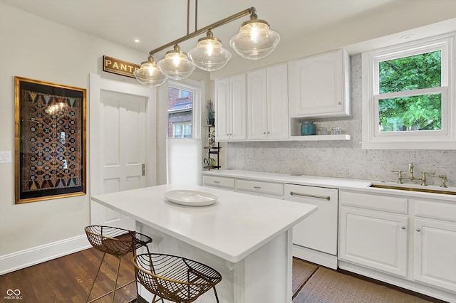 847 N Park Ave, Indianapolis, IN 46202 - kitchen featuring a sink, decorative backsplash, white cabinetry, and light countertops