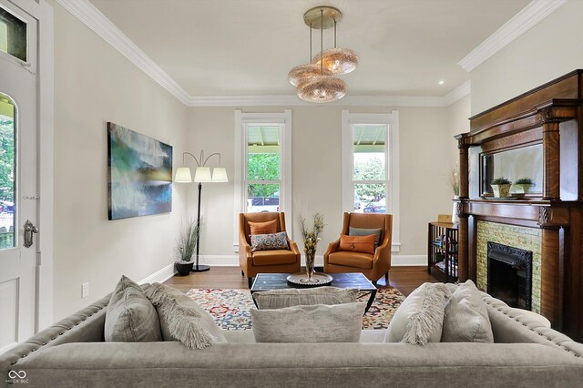 847 N Park Ave, Indianapolis, IN 46202 - living room featuring wood finished floors, baseboards, a stone fireplace, and ornamental molding