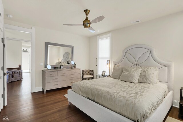 847 N Park Ave, Indianapolis, IN 46202 - bedroom with dark wood-style flooring, baseboards, and ceiling fan