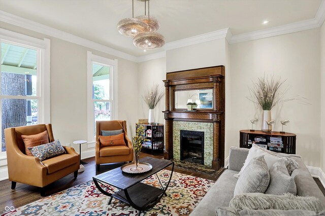847 N Park Ave, Indianapolis, IN 46202 - living area featuring wood finished floors, a stone fireplace, baseboards, and ornamental molding