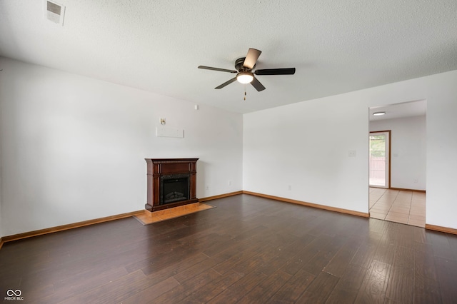 6715 Wandering Way, Indianapolis, IN 46241 - unfurnished living room with ceiling fan, wood finished floors, baseboards, and a fireplace