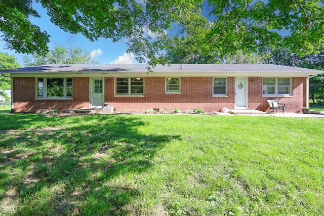 6310 E County Road 200 S, Butlerville, IN 47223 - single story home featuring a front yard, brick siding, and entry steps