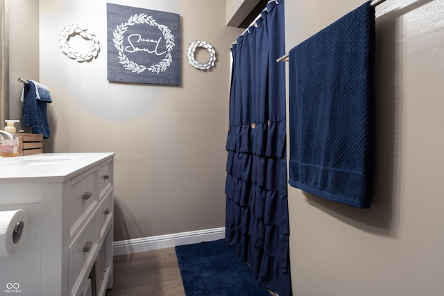 6310 E County Road 200 S, Butlerville, IN 47223 - full bathroom with wood finished floors, vanity, and curtained shower