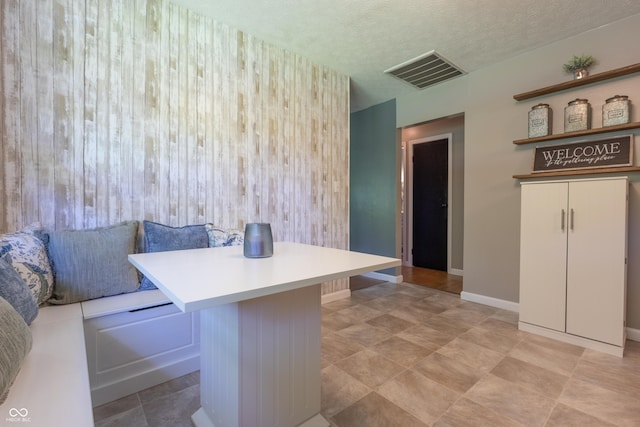 6310 E County Road 200 S, Butlerville, IN 47223 - dining area featuring baseboards and a textured ceiling