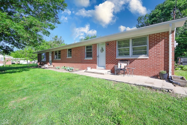 6310 E County Road 200 S, Butlerville, IN 47223 - ranch-style house with a front lawn and brick siding