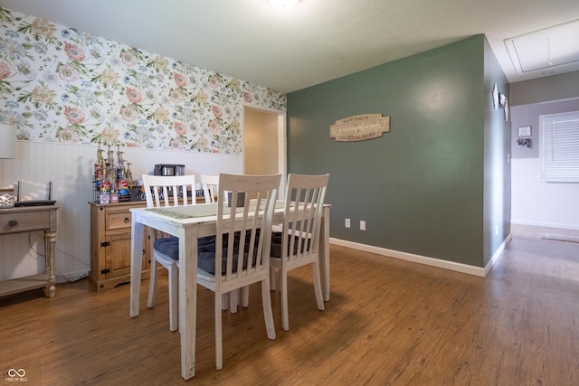 6310 E County Road 200 S, Butlerville, IN 47223 - dining room with wallpapered walls, wainscoting, wood finished floors, and attic access