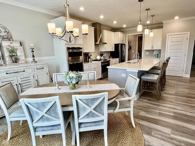 3691 Talmine Ln, Bargersville, IN 46106 - kitchen with wall chimney range hood, range, double oven, crown molding, and freestanding refrigerator