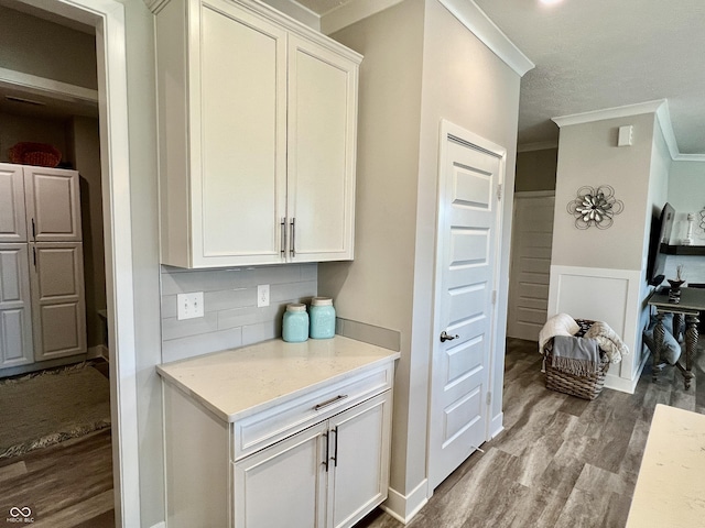 3691 Talmine Ln, Bargersville, IN 46106 - kitchen featuring crown molding, dark wood-style flooring, decorative backsplash, white cabinets, and light stone countertops