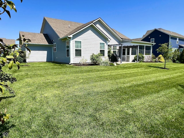 3691 Talmine Ln, Bargersville, IN 46106 - rear view of house with a sunroom, a yard, and roof with shingles