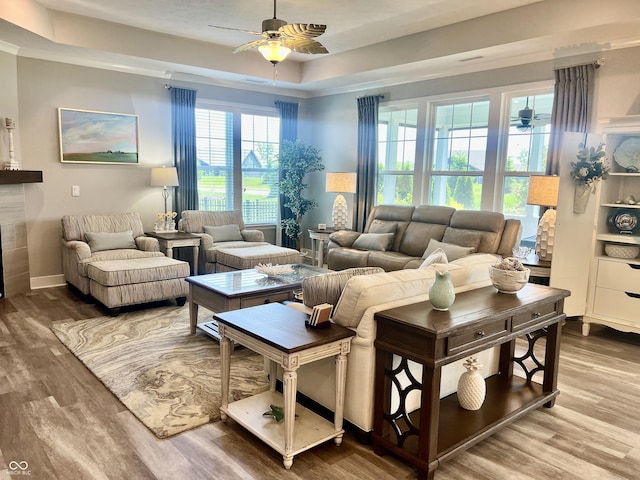 3691 Talmine Ln, Bargersville, IN 46106 - living room featuring ceiling fan, wood finished floors, a raised ceiling, and baseboards