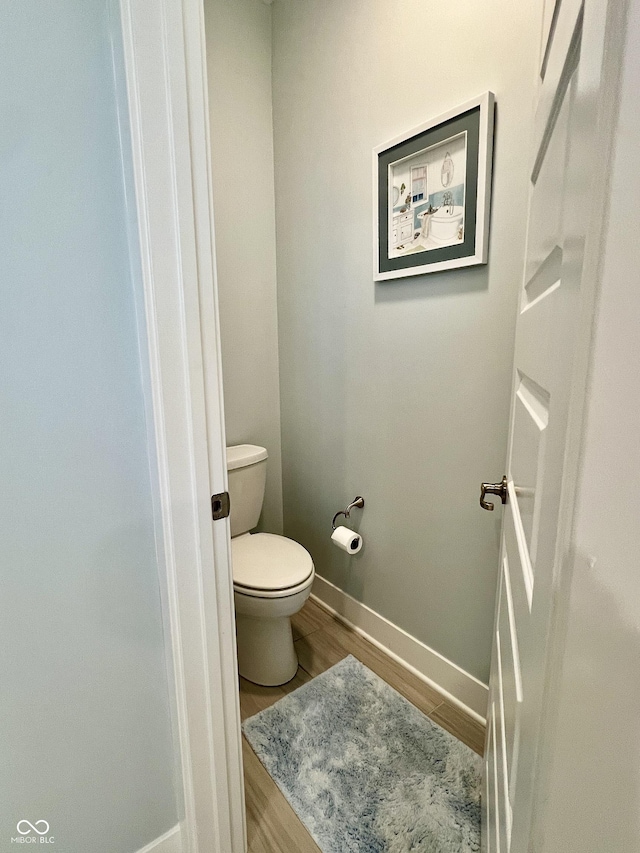 3691 Talmine Ln, Bargersville, IN 46106 - bathroom with baseboards, wood finished floors, and toilet