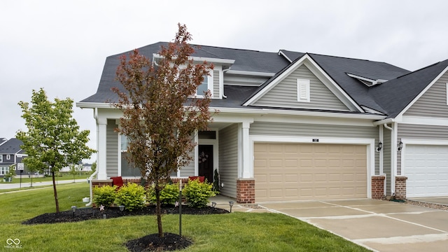 747 Tuxedo Dr, Westfield, IN 46074 - view of front of property featuring concrete driveway, a front lawn, brick siding, and a garage