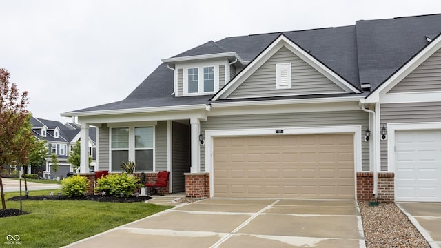 747 Tuxedo Dr, Westfield, IN 46074 - view of front of house featuring brick siding, driveway, covered porch, and a front yard