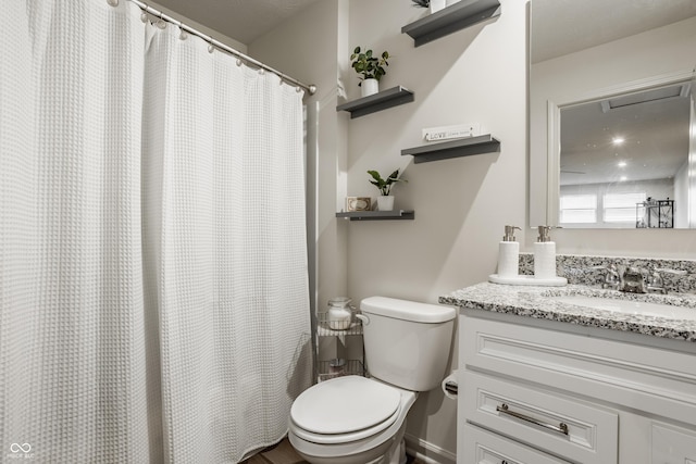 747 Tuxedo Dr, Westfield, IN 46074 - bathroom featuring toilet, vanity, and baseboards