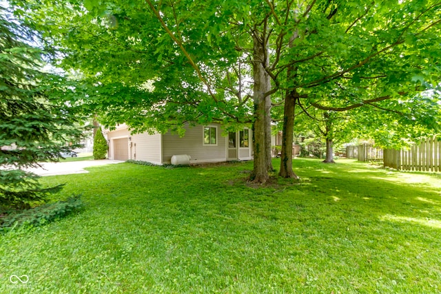 1941 Orchard Ct, Carmel, IN 46280 - view of yard with an attached garage and driveway