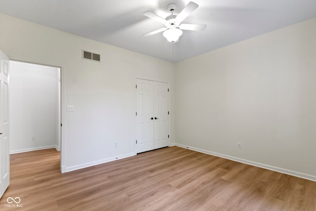 1941 Orchard Ct, Carmel, IN 46280 - unfurnished bedroom featuring light wood-type flooring, baseboards, a closet, and a ceiling fan