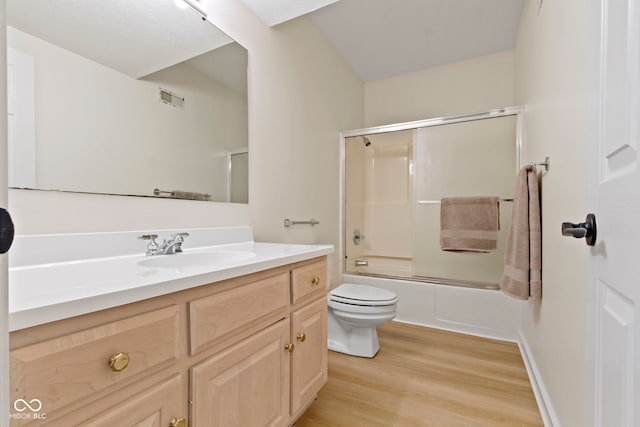 1941 Orchard Ct, Carmel, IN 46280 - full bathroom with wood finished floors, vanity, toilet, and bath / shower combo with glass door